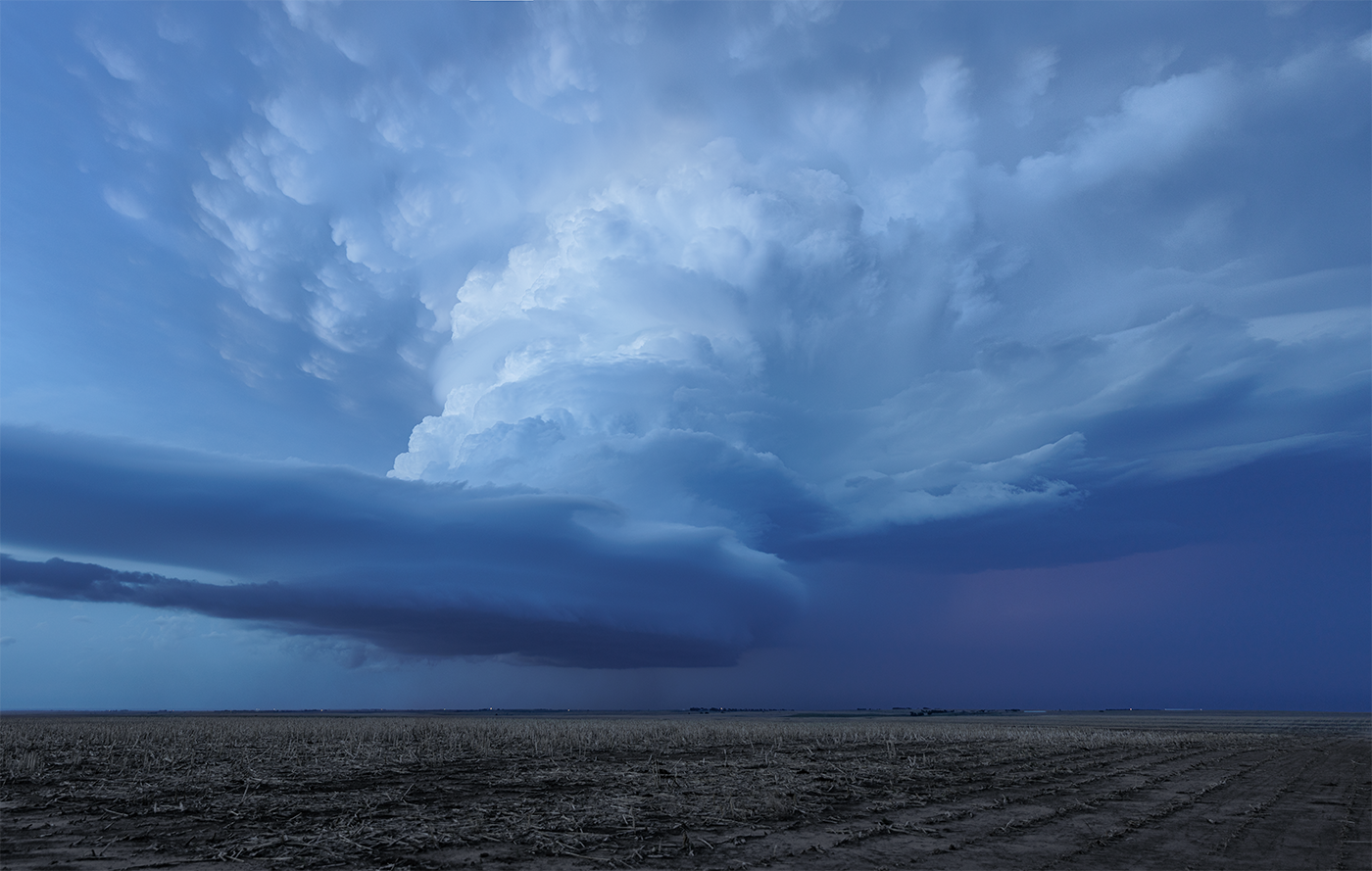 Photographic print of a spectacular striated thunderstorm updraft during blue hour.