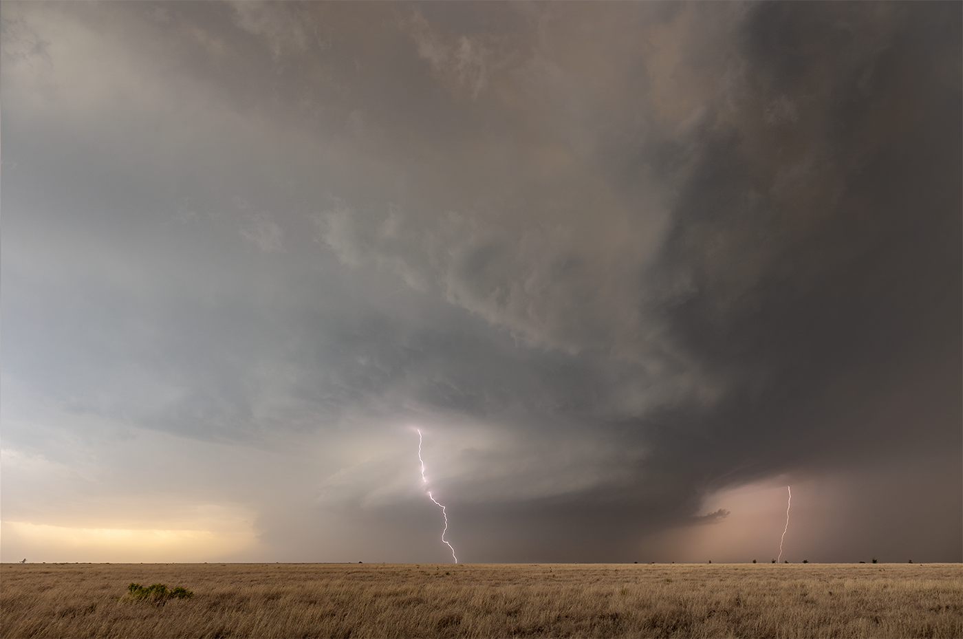 Photographic print of the Morton, Texas supercell from May 2022 as dust shrouds the updraft base with lightning strikes either side.