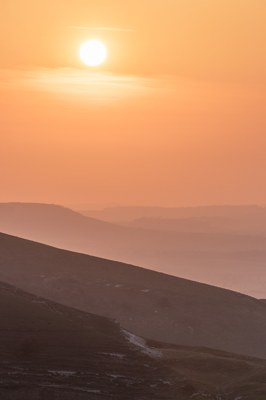 Photographic print of evening mist reducing the Sussex Downs to layers fading into the distance.