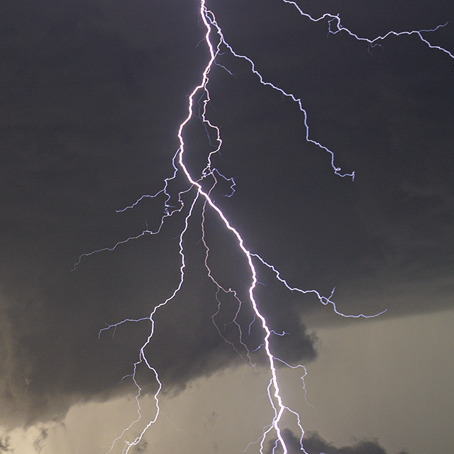 Closeup of forked lightning containing many colourful branches near Eunice, NM