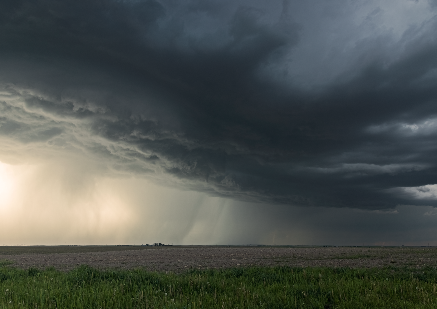 Dark storm cloud over Nebraska farmland.