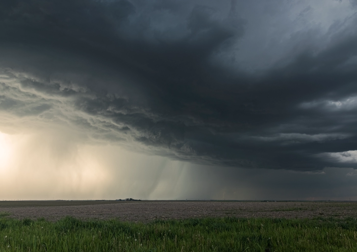 Dark storm cloud over Nebraska farmland.